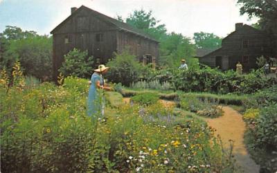 At work in Herb Garden Sturbridge, Massachusetts Postcard